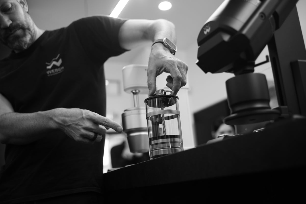 Douglas Weber demonstrating a manual coffee brewing step