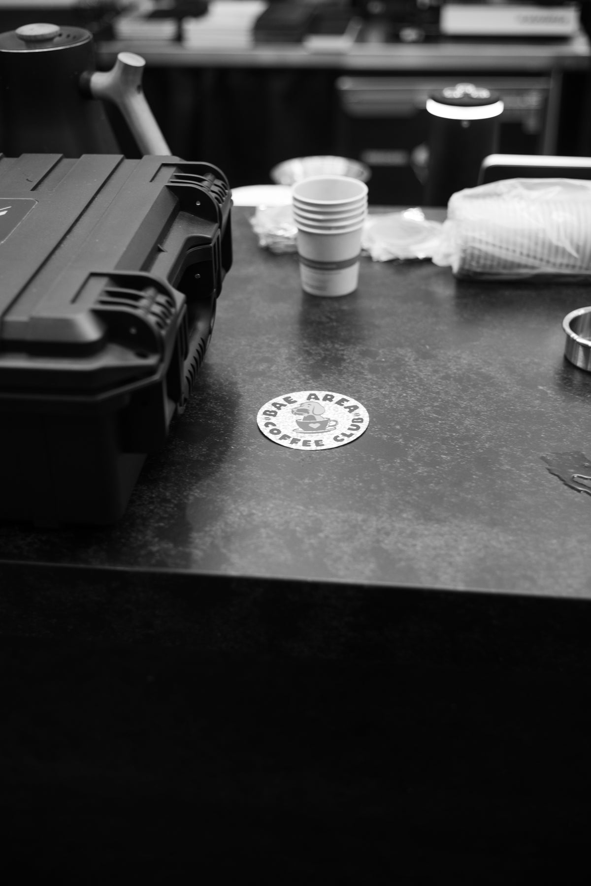 Kaizen & Coffee logo beside workshop brewing equipment