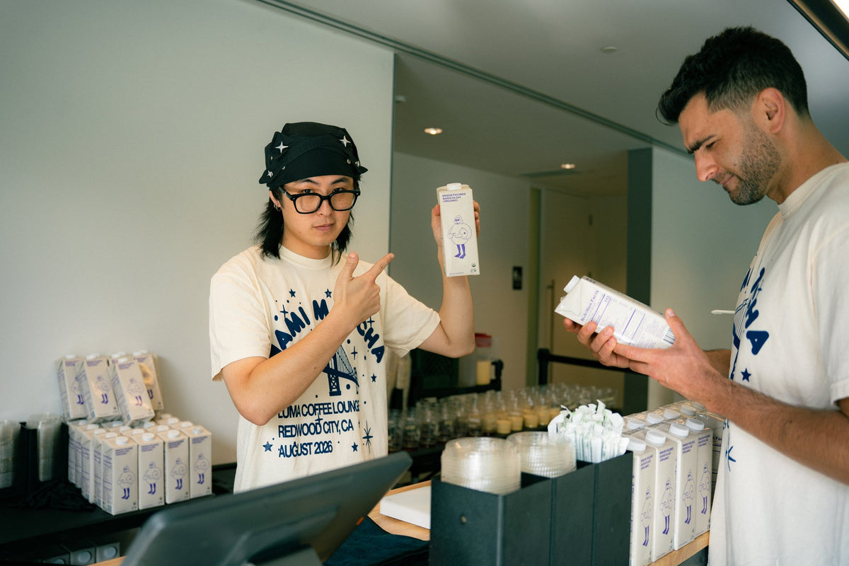 Nami Matcha event team members unpacking matcha cartons at Luma Coffee