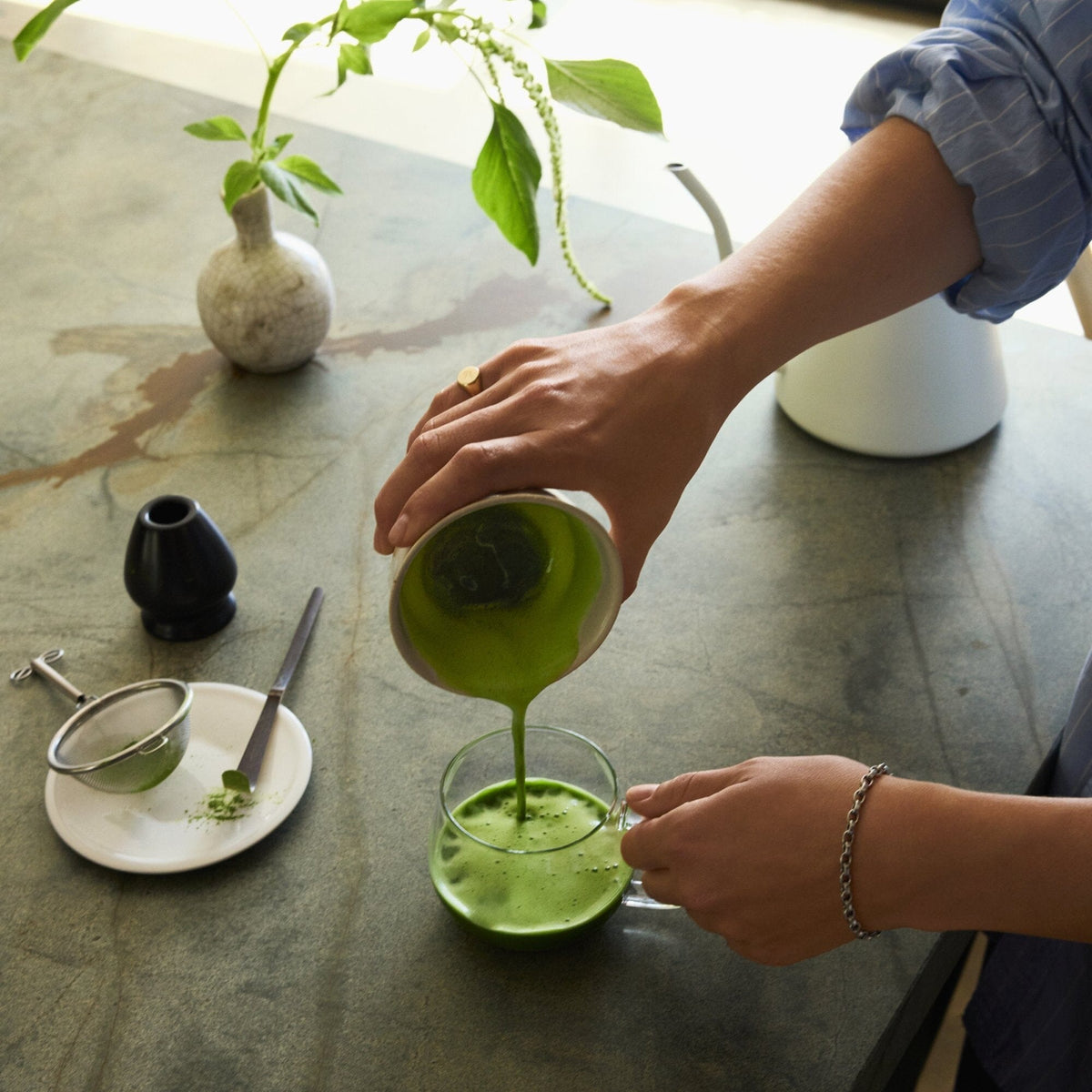 Rishi Teahouse Matcha being poured into a glass; teaware not included
